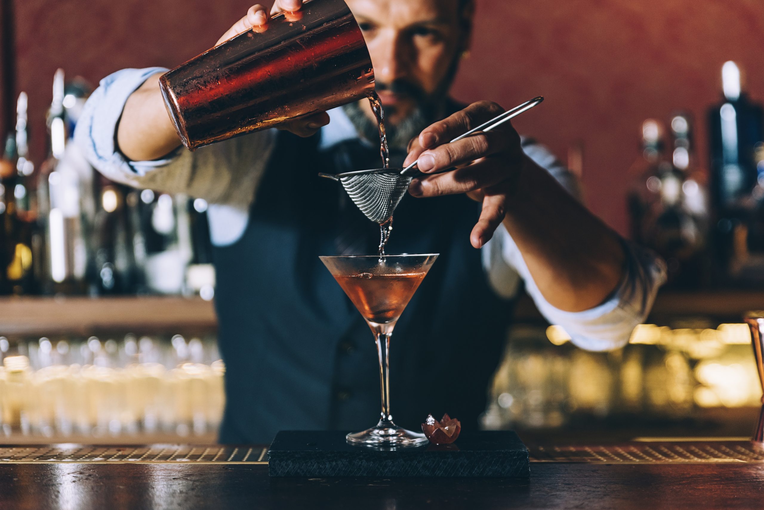 https://www.thedrinksbusiness.com/content/uploads/2023/12/cocktail-making-scaled.jpg